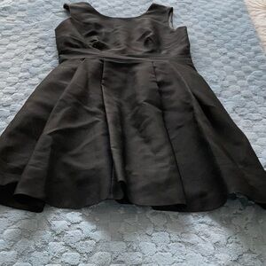 A little black dress! open square back with bow, classy front w pockets